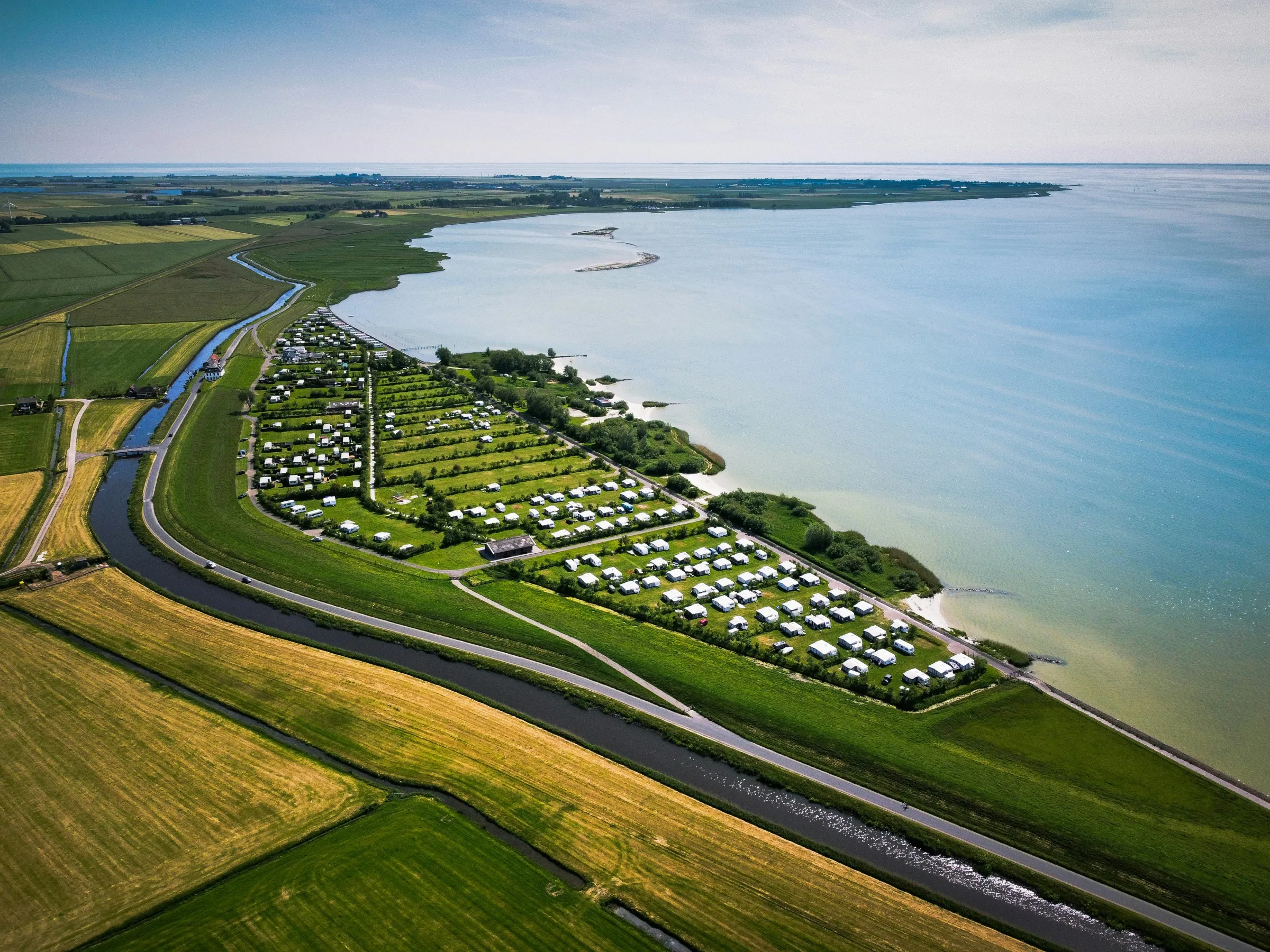 Aerial view of a campground on a lake shore